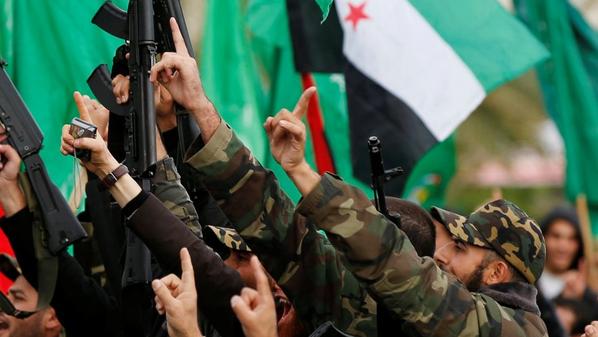 مشعل يرفع علم “الثورة السورية”