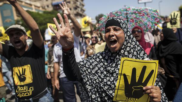 قتيلان و14 مصابا في اشتباكات الأهالي مع أنصار الإخوان