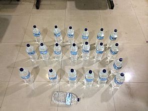 ضبط آسيويين بحوزتهما 112 زجاجة خمر