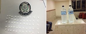ضبط إيراني وهندي بحبوب وخمر في أبوحليفة