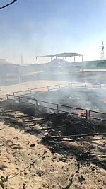 حريق مخيم على طريق الدائري السادس