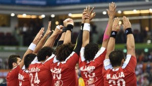 Players from Egypt hold up their hands to defend against a penalty shot during the 24th Men's Handball World Championships preliminary round Group C match between Sweeden and Egypt at the Ali Bin Hamad Al Attiya Arena in Doha on January 22, 2015. AFP PHOTO / FAYEZ NURELDINE (Photo credit should read FAYEZ NURELDINE/AFP/Getty Images)