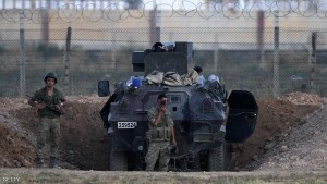 SANLIURFA, TURKEY - JUNE 16: Turkish soldiers stand guarded near the Akcakale border gate in Sanliurfa province, Turkey, June 16, 2015. Kurdish fighters took full control on Tuesday of the border town of Tal Abyad, dealing a major blow to the Islamic State group's ability to wage war in Syria by cutting off a vital supply line to its self-proclaimed capital of Raqqa. According to Turkish security officials 10,000 people to come across from Syria in last three days.(Photo by Gokhan Sahin/Getty Images)