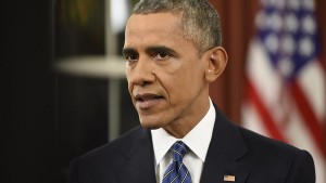 President Barack Obama addresses the nation from the Oval Office at the White House in Washington, Sunday night, Dec. 6, 2016. In a rare Oval Office address, Obama vowed the United States would overcome a terror threat that has entered a "new phase" as he sought to reassure Americans shaken by recent attacks in Paris and California. (Saul Loeb/Pool Photo via AP)