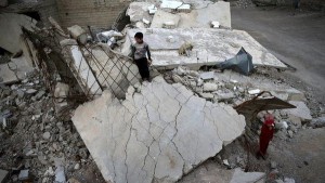 Children play on rubble of damaged buildings in the rebel held besieged town of Douma, eastern Damascus suburb of Ghouta, Syria March 19, 2016. REUTERS/Bassam Khabieh