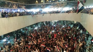 Followers of Iraq's Shi'ite cleric Moqtada al-Sadr are seen in the parliament building as they storm Baghdad's Green Zone in Iraq