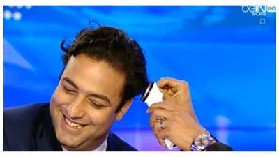 بالفيديو…ميدو ينفذ وعده بحلاقة شعره على الهواء بعد تتويج ليستر بالبريميرليج