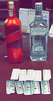 جمارك مطار الكويت تضبط وافدة مصرية حاولت تهريب ٨٠ حبة تريمادول وزجاجتي خمر