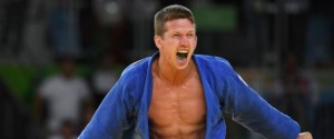 TOPSHOT - Belgium's Dirk van Tichelt celebrates after defeating Hungary's Miklos Ungvari during their men's -73kg judo contest bronze medal B match of the Rio 2016 Olympic Games in Rio de Janeiro on August 8, 2016. / AFP / Toshifumi KITAMURA        (Photo credit should read TOSHIFUMI KITAMURA/AFP/Getty Images)