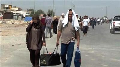 فرار الاف العراقيين من الموصل الى سوريا