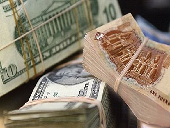 الدولار يتراجع لاول مرة في السوق السوداء أمام الجنيه المصري