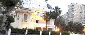 Army soldiers and riot police stand guard outside the Saudi Arabia Embassy in Cairo