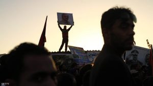 A Libyan protestor carries a placard depicting a portrait of general Khalifa Haftar during a demonstration in support of the army and against the UN-backed unity government in the city of Benghazi on March 18, 2016. Libya's authorities that are backed by an internationally recognised parliament said Friday they oppose a UN-backed unity government from starting work inside the country. / AFP / ABDULLAH DOMA (Photo credit should read ABDULLAH DOMA/AFP/Getty Images)