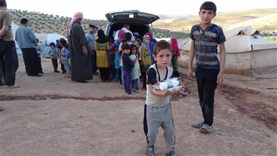 «النجاة الخيرية» توزع وجبات إفطار صائم على اللاجئين السوريين بالأردن