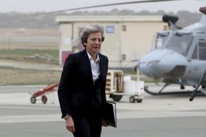 British Prime Minister Theresa May walks during her visit to RAF Akrotiri, one of two military bases Britain maintains on the east Mediterranean island of Cyprus, December 22, 2017. REUTERS/Petros Karadjias/Pool